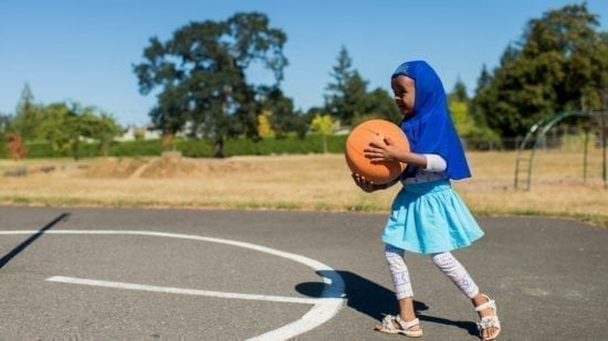 little girl with basketball