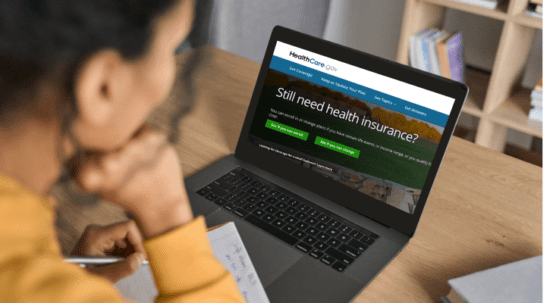 woman looking up health insurance on computer